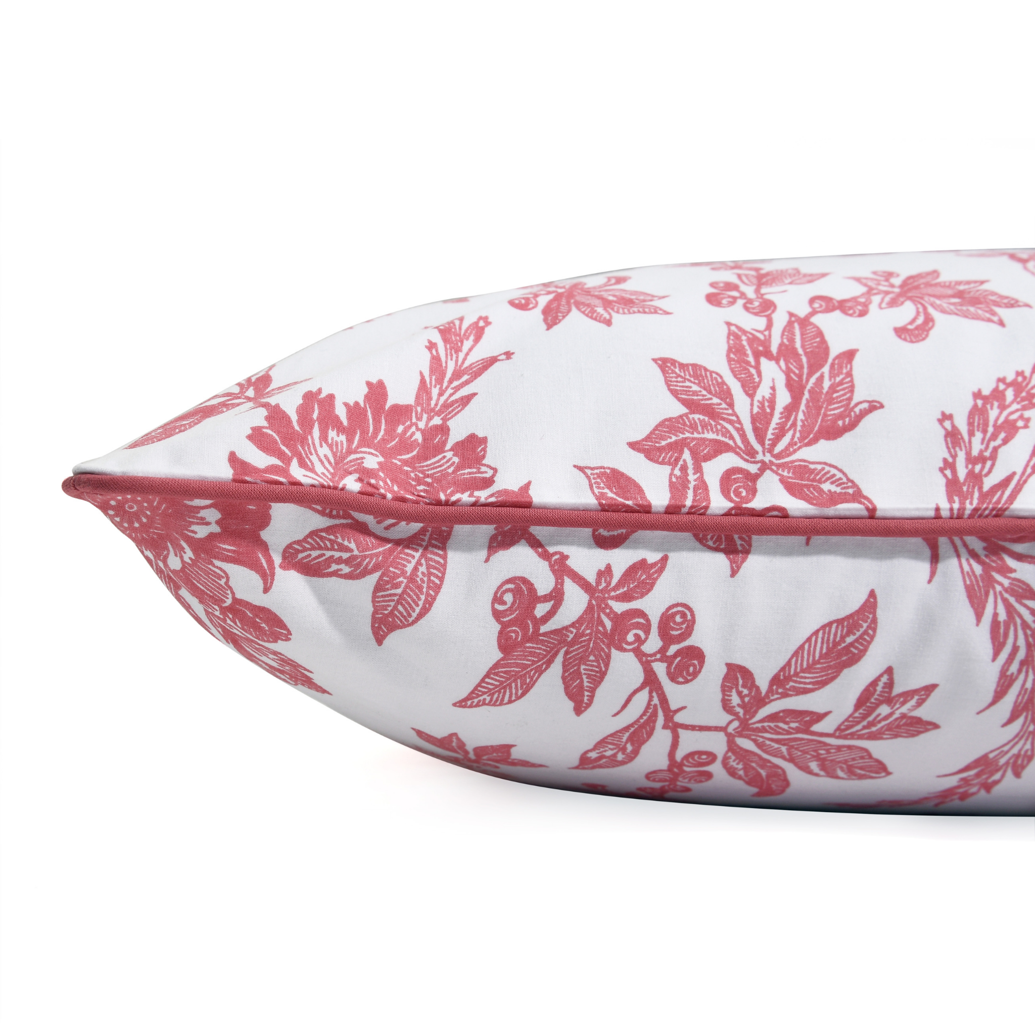 Floral-patterned pillow with pink design on a white background