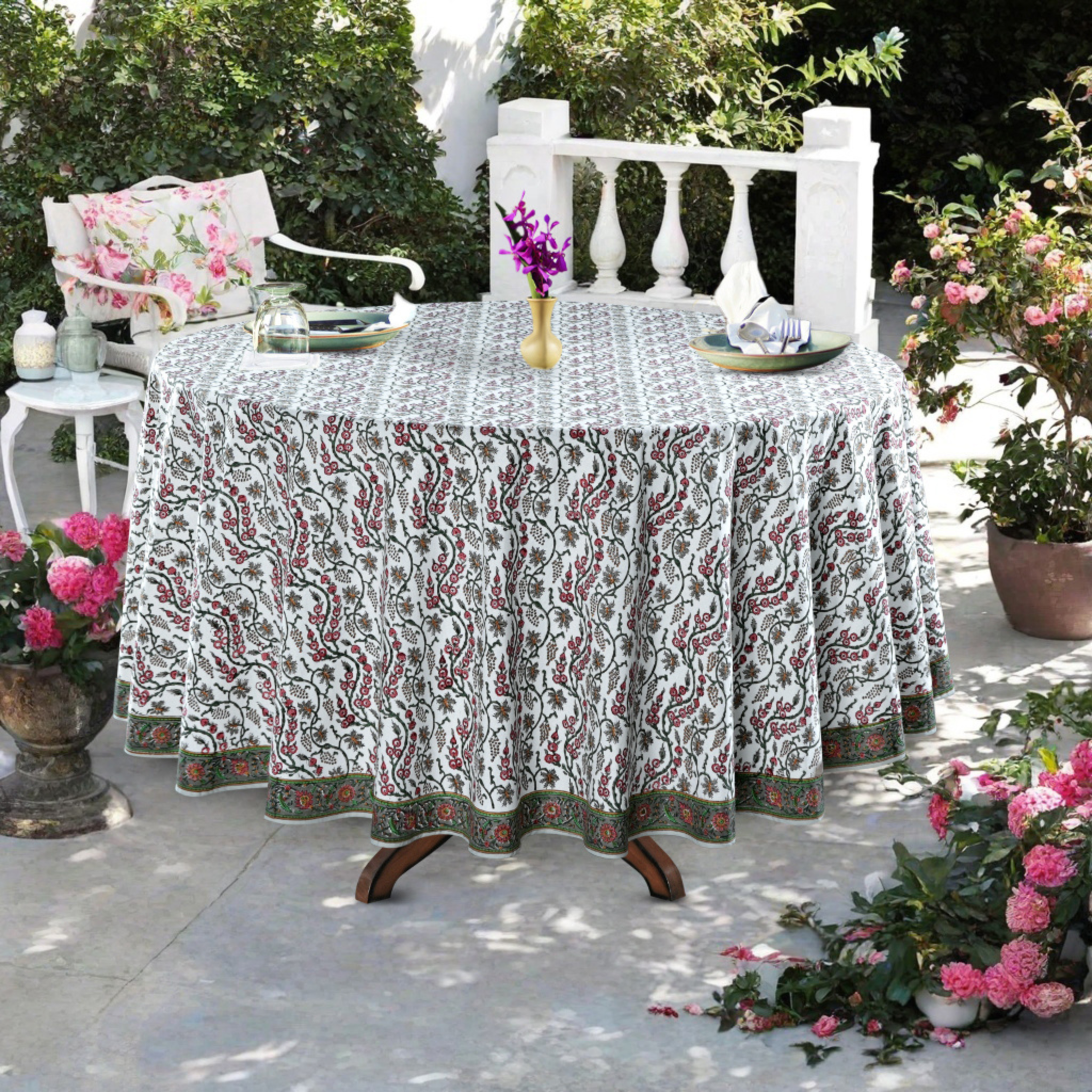 Decorative tablecloth with floral pattern on a table outdoors