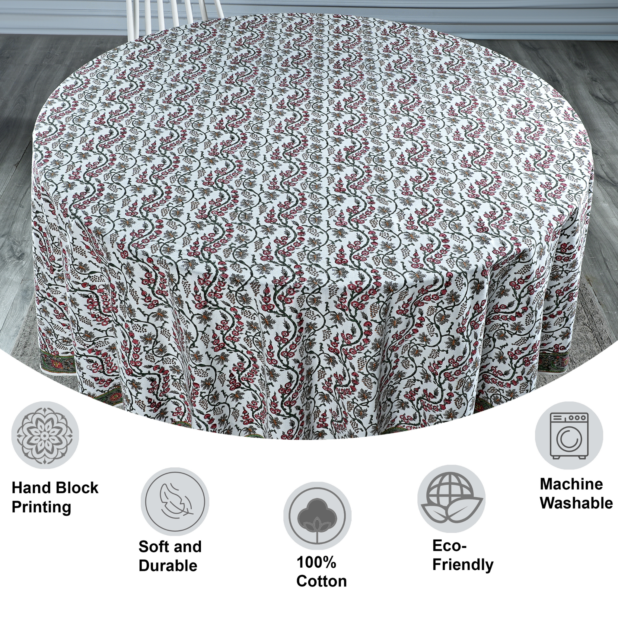 Round tablecloth with floral pattern on a wooden floor, featuring icons and text about material and care.