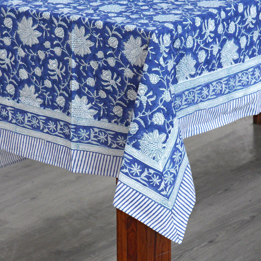 Blue floral patterned tablecloth on a wooden table
