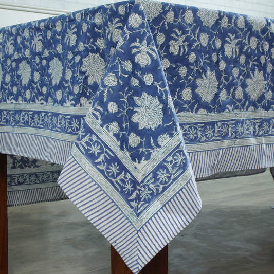Blue floral patterned tablecloth on a wooden table