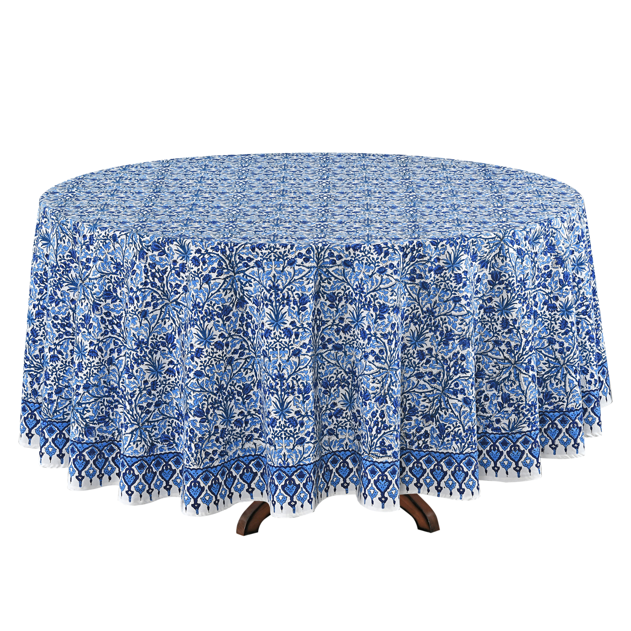 Blue floral patterned tablecloth on a round table with a white background