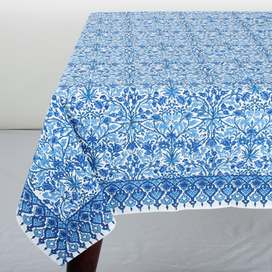 Blue floral patterned tablecloth on a gray surface
