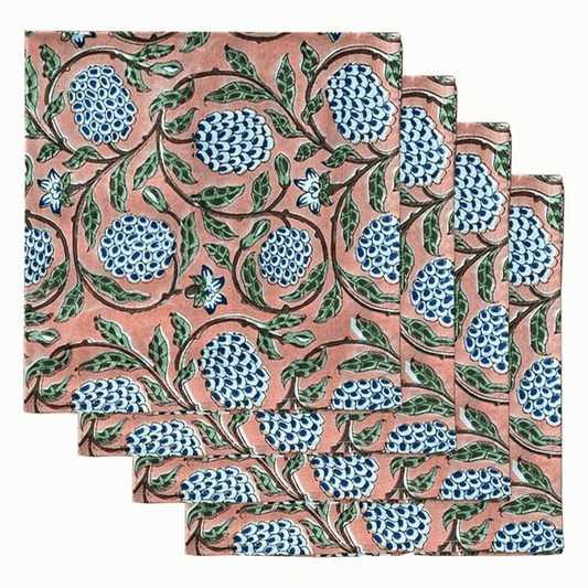 Set of three floral patterned napkins on a white background