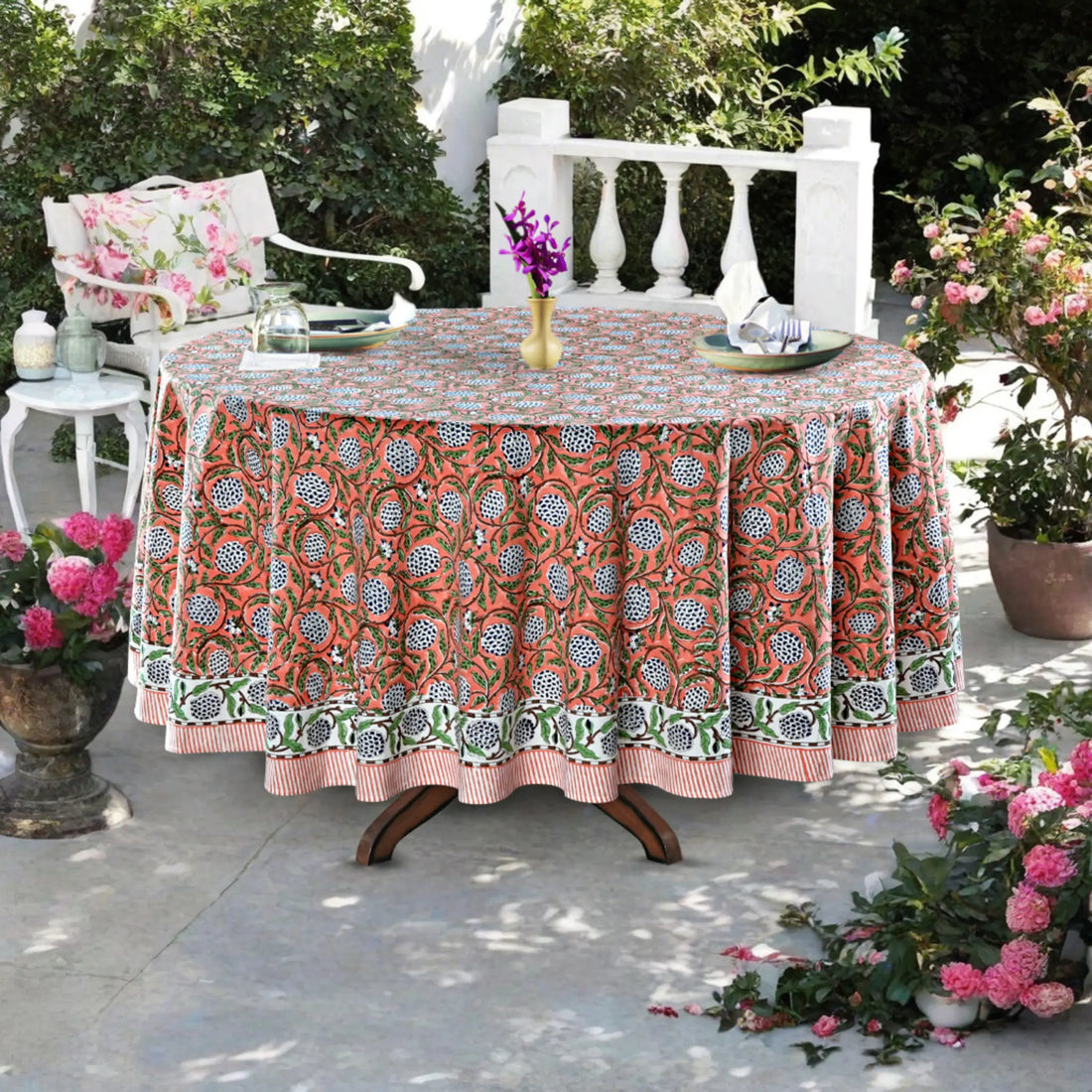 Decorative tablecloth with floral pattern on a table outdoors