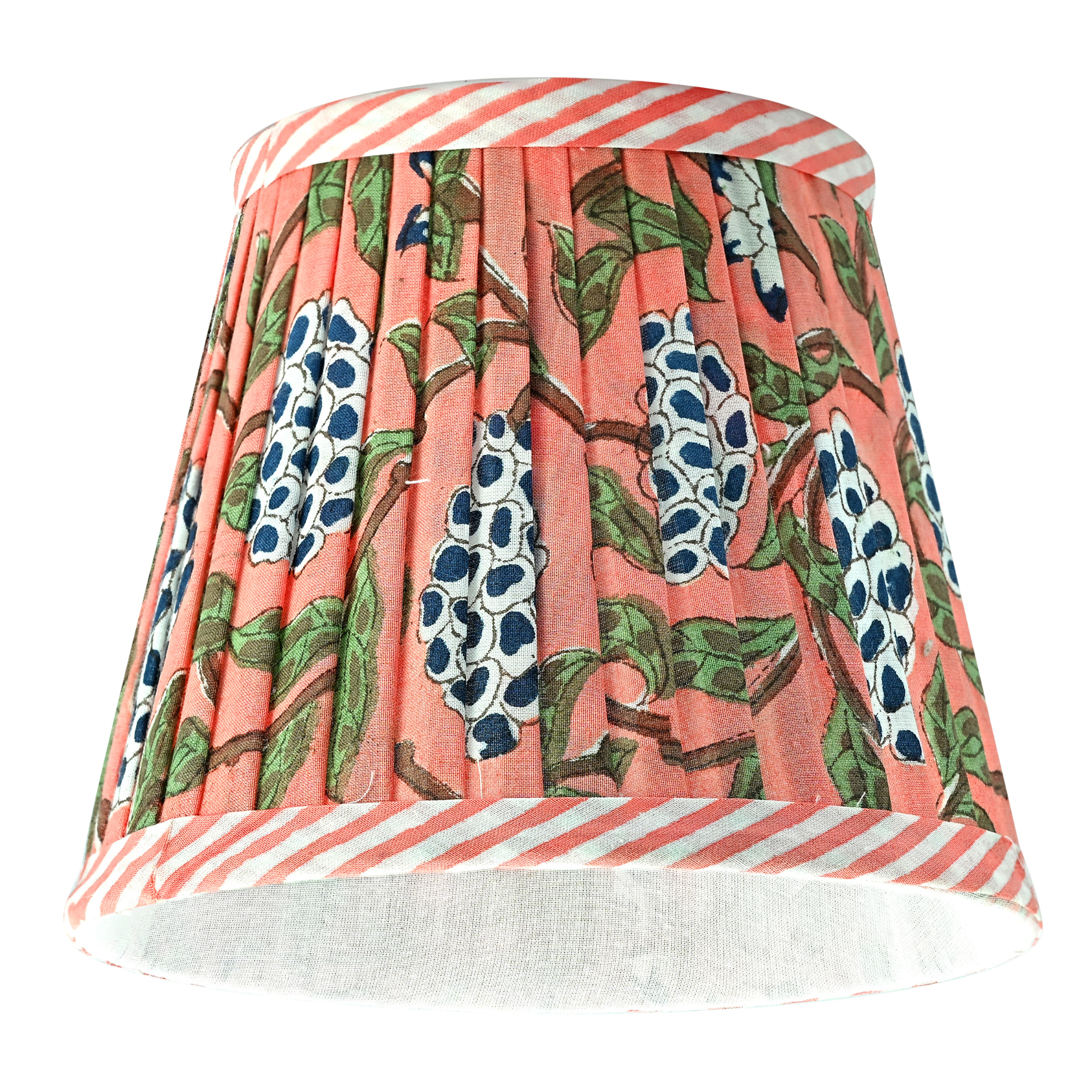 Floral patterned lampshade with striped base on a white background