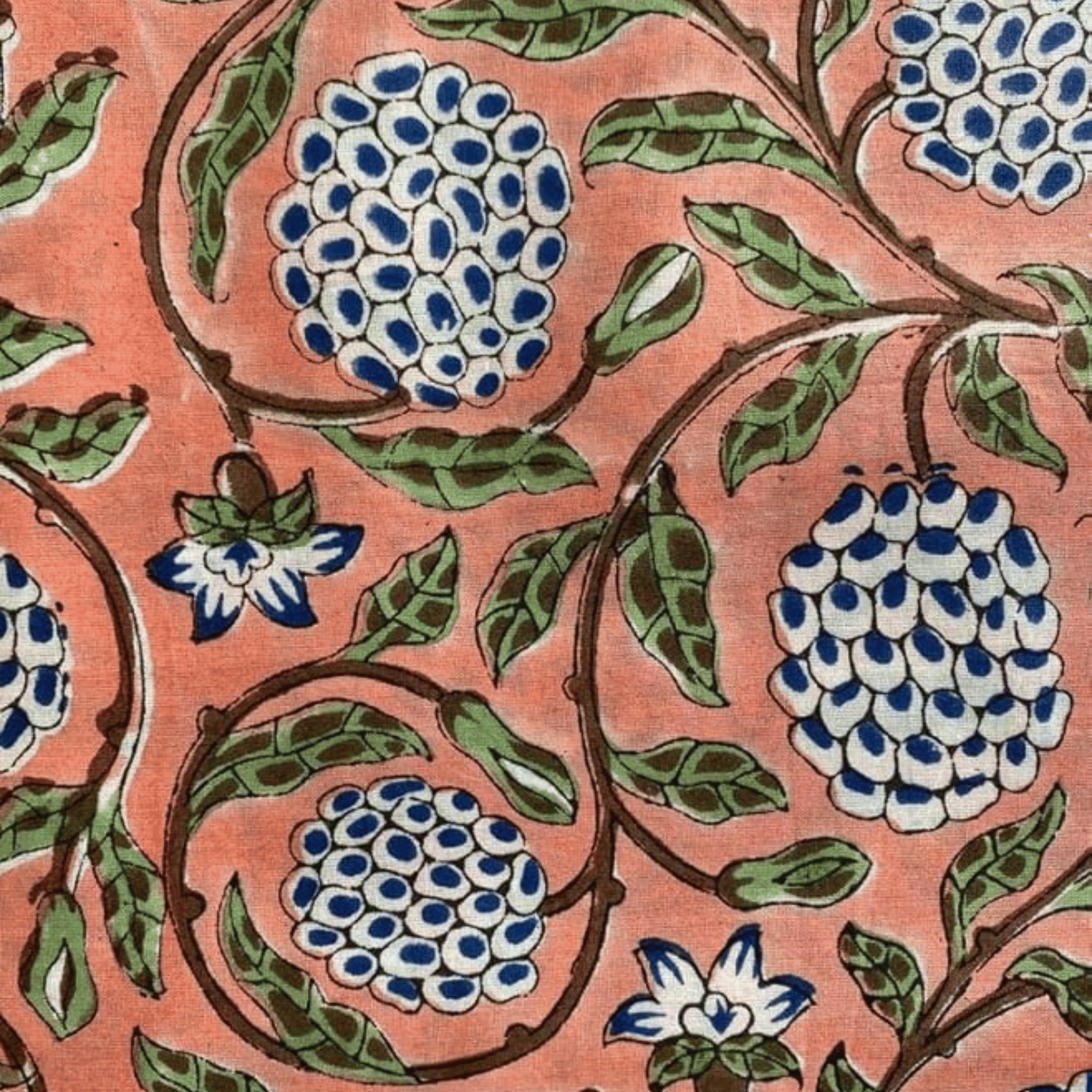 Close-up of a floral pattern with blue and white flowers on a pink background