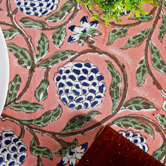 Close-up of a fabric with floral pattern on a pink background