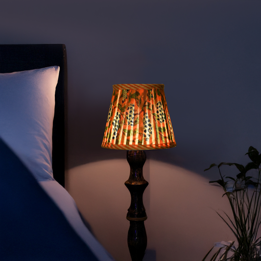 Decorative lamp on a bedside table with a dark background