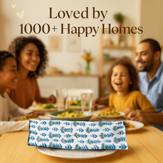 Family enjoying a meal together with a decorative napkin on a table, text 'Loved by 1000+ Happy Homes' above.