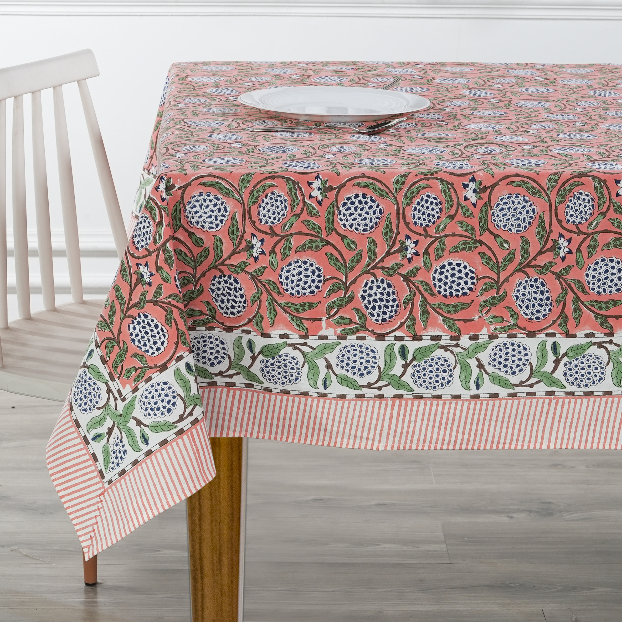 Tablecloth with floral pattern on a wooden table