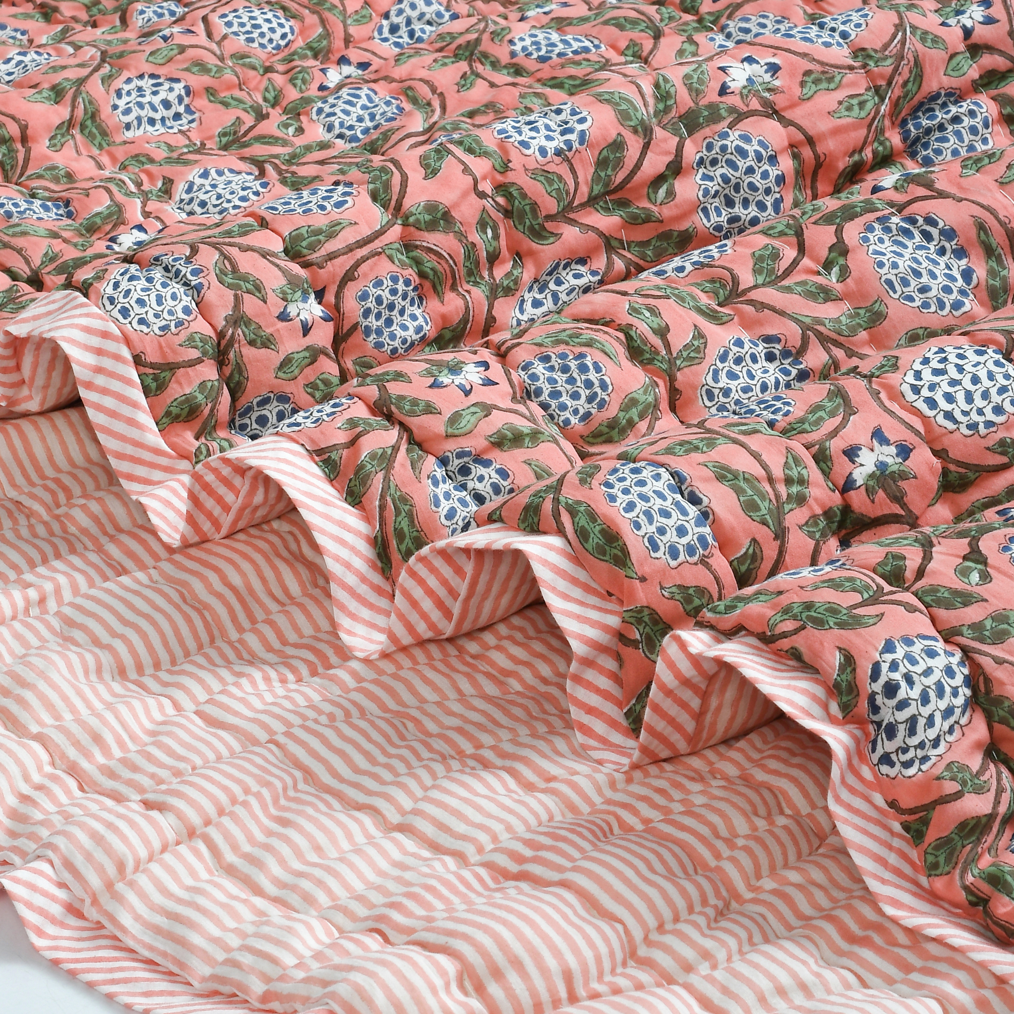 Floral patterned fabric with a pink and white striped background