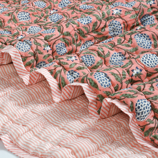 Floral patterned fabric with a pink and white striped background