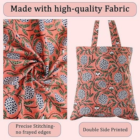 Tote bag with pomegranate pattern and high-quality fabric details on a pink background