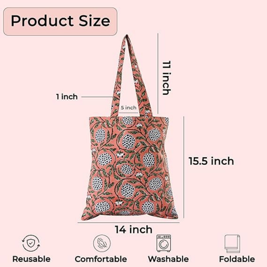 Reusable tote bag with floral pattern and measurements on a pink background