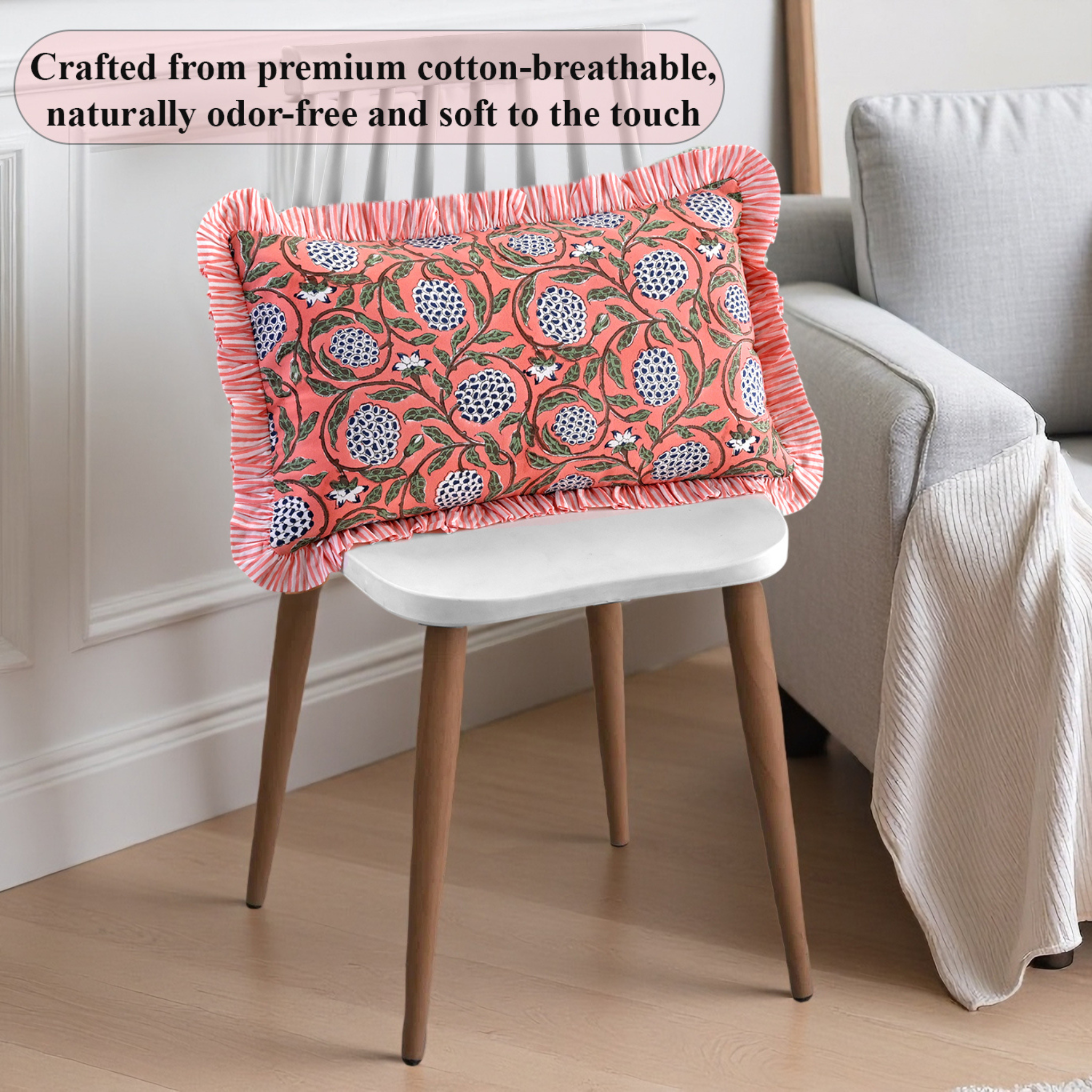 Decorative pillow with floral pattern on a chair in a room setting