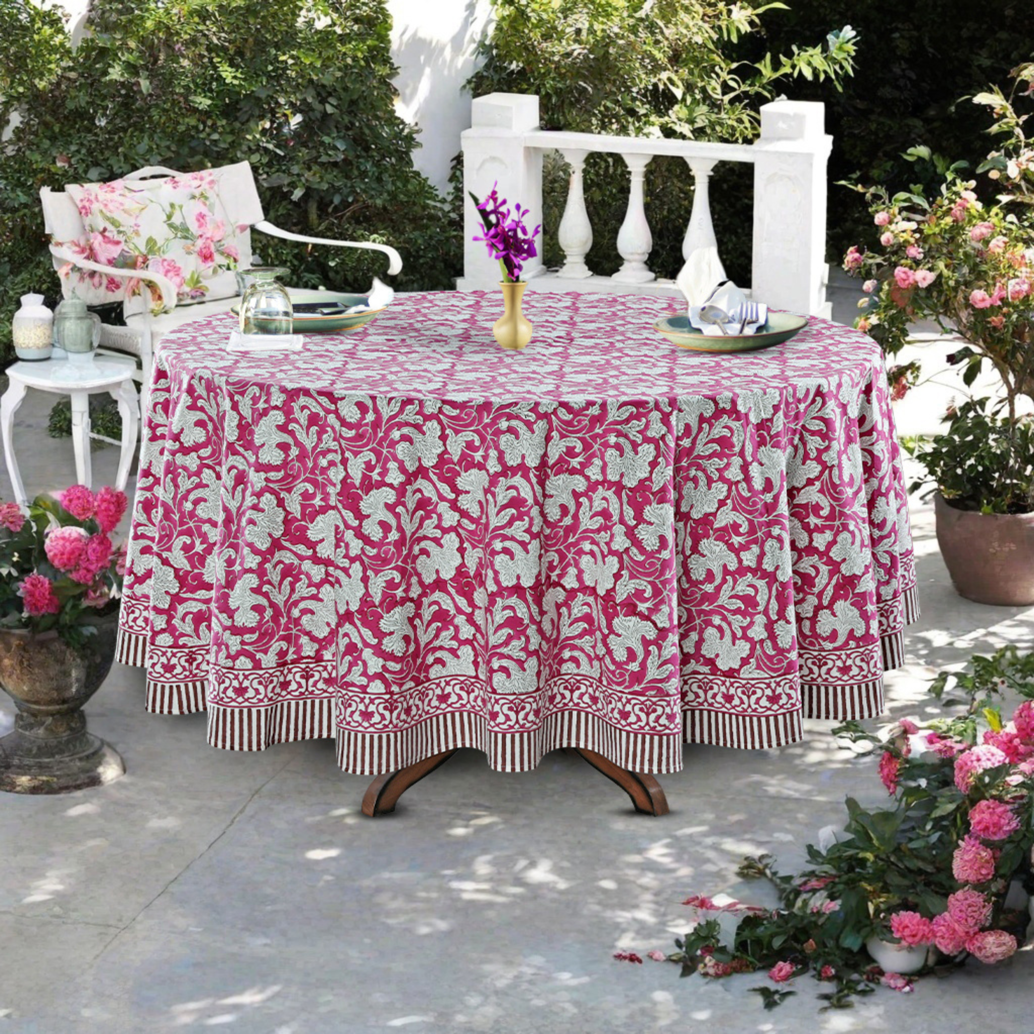 Tablecloth with pink and white floral pattern on a table outdoors