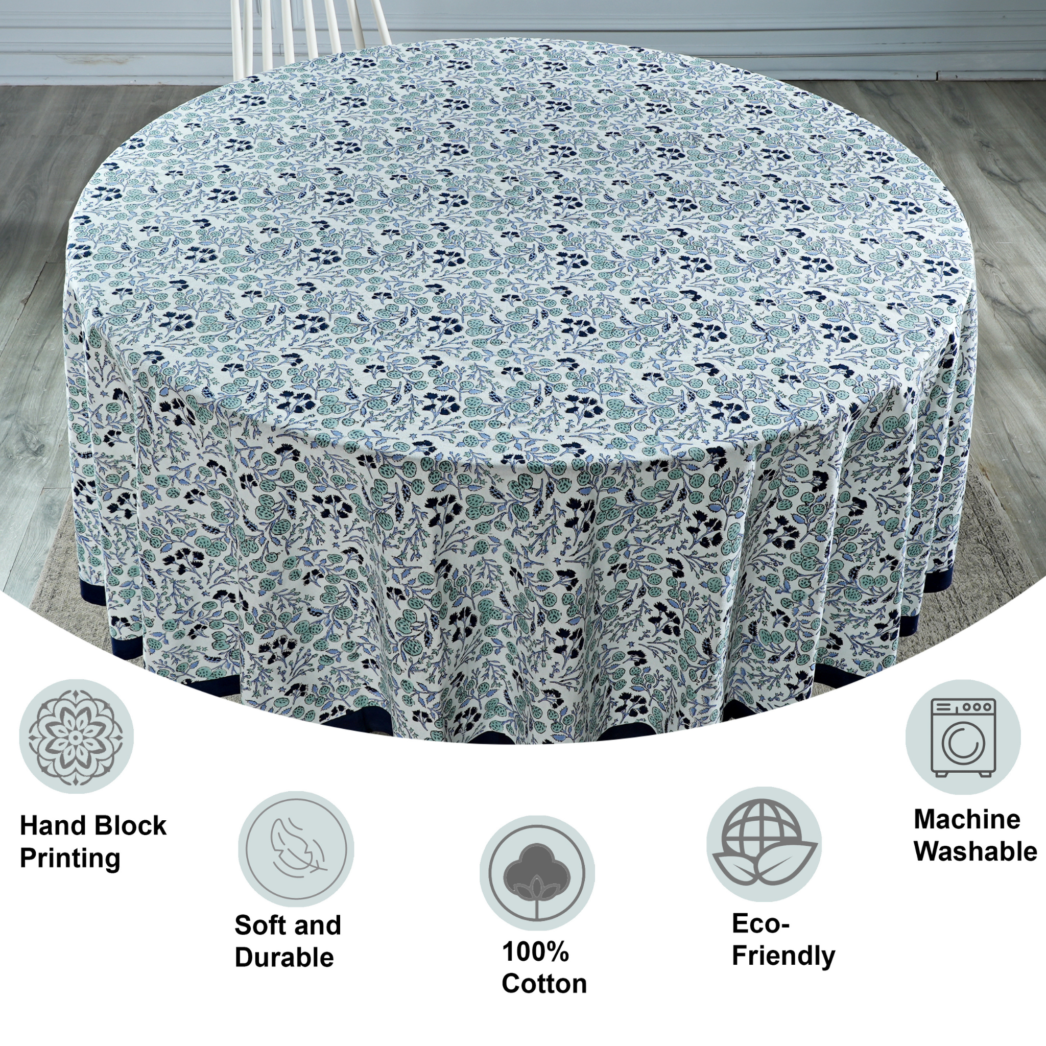 Round tablecloth with floral pattern on a wooden floor, featuring icons and text about material and care.