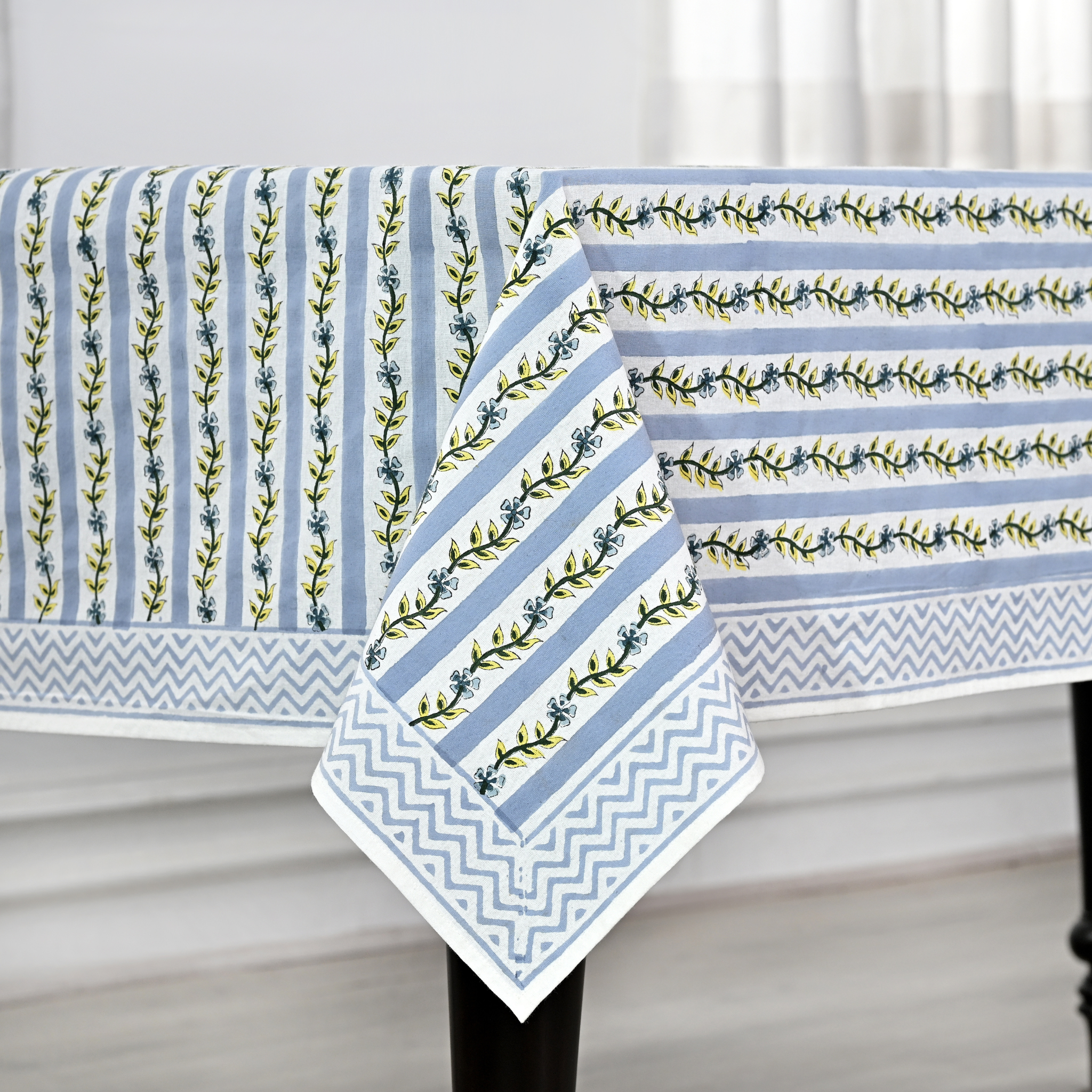 Tablecloth with blue and white striped pattern on a table