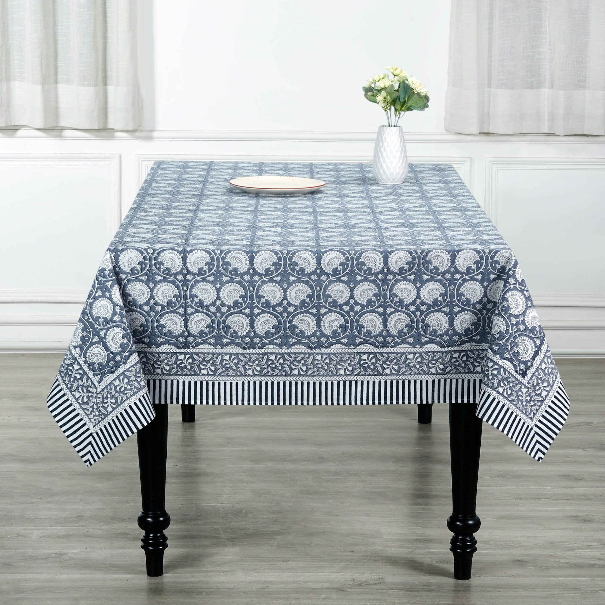 Tablecloth with blue and white pattern on a wooden table