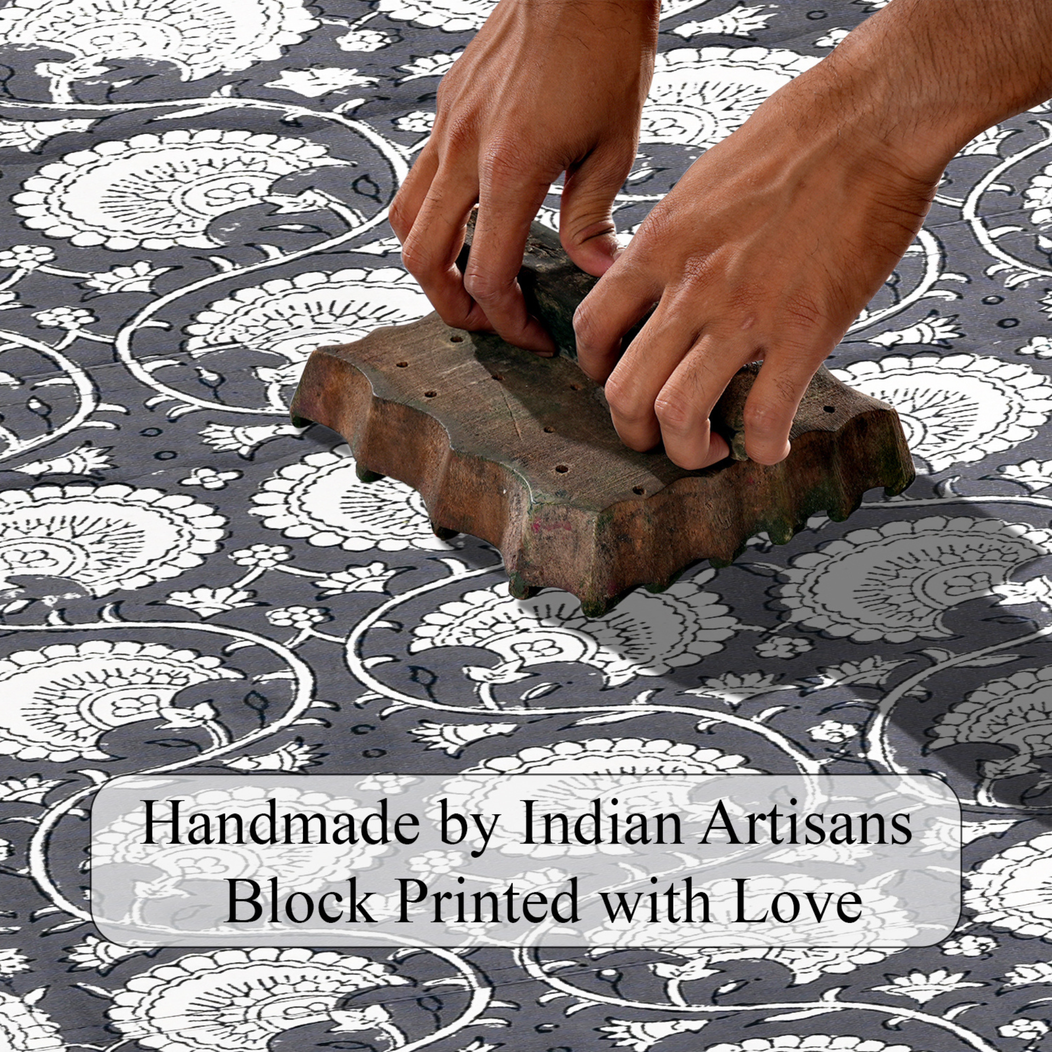 Hand block printing on fabric with text 'Handmade by Indian Artisans Block Printed with Love'.