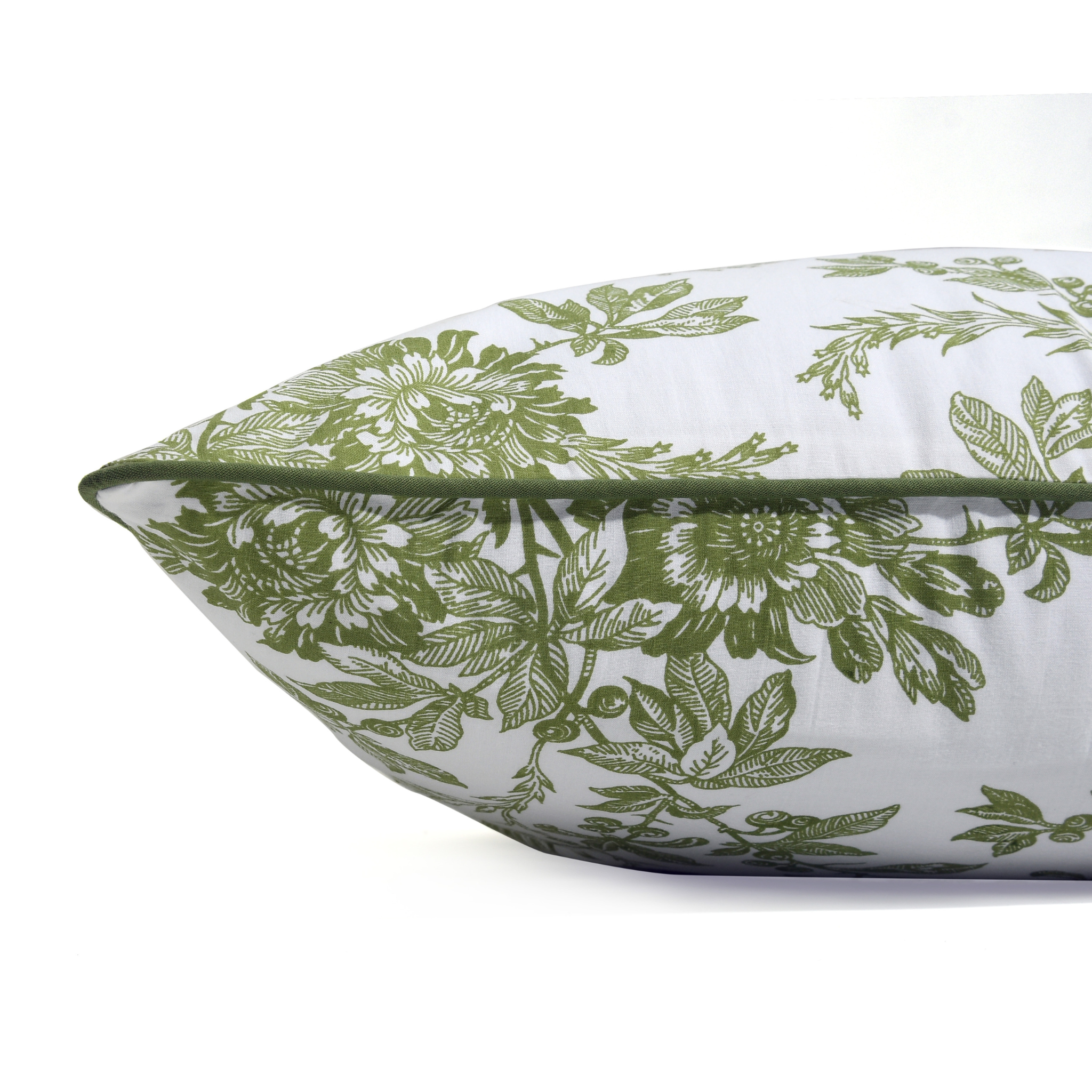 Floral patterned pillow with green leaves on a white background