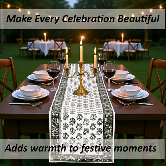 Dining table set for a celebration with candles and a decorative table runner.