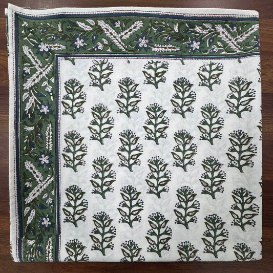 Fabric with floral pattern on a wooden surface