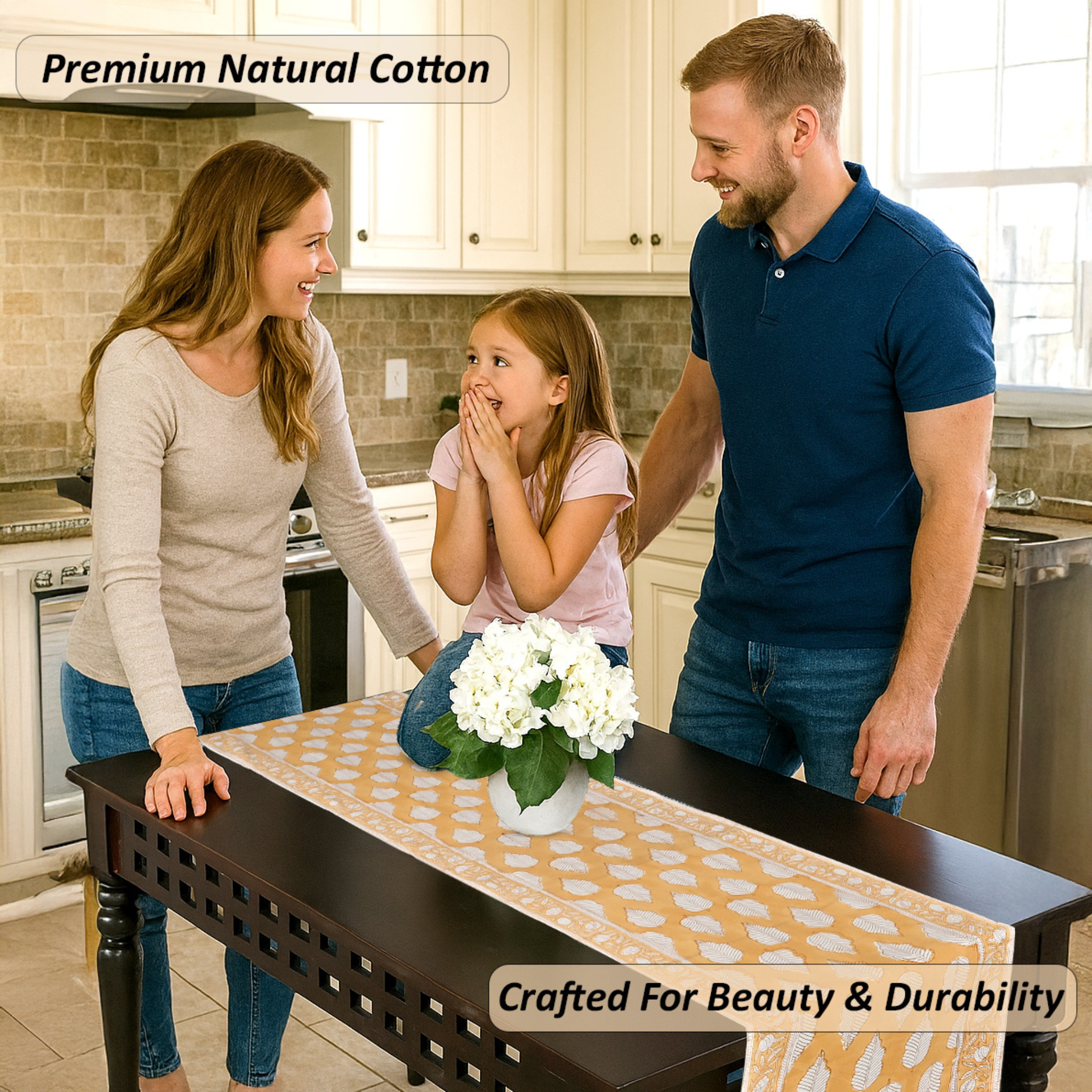 Family in a kitchen with a table runner featuring white flowers.