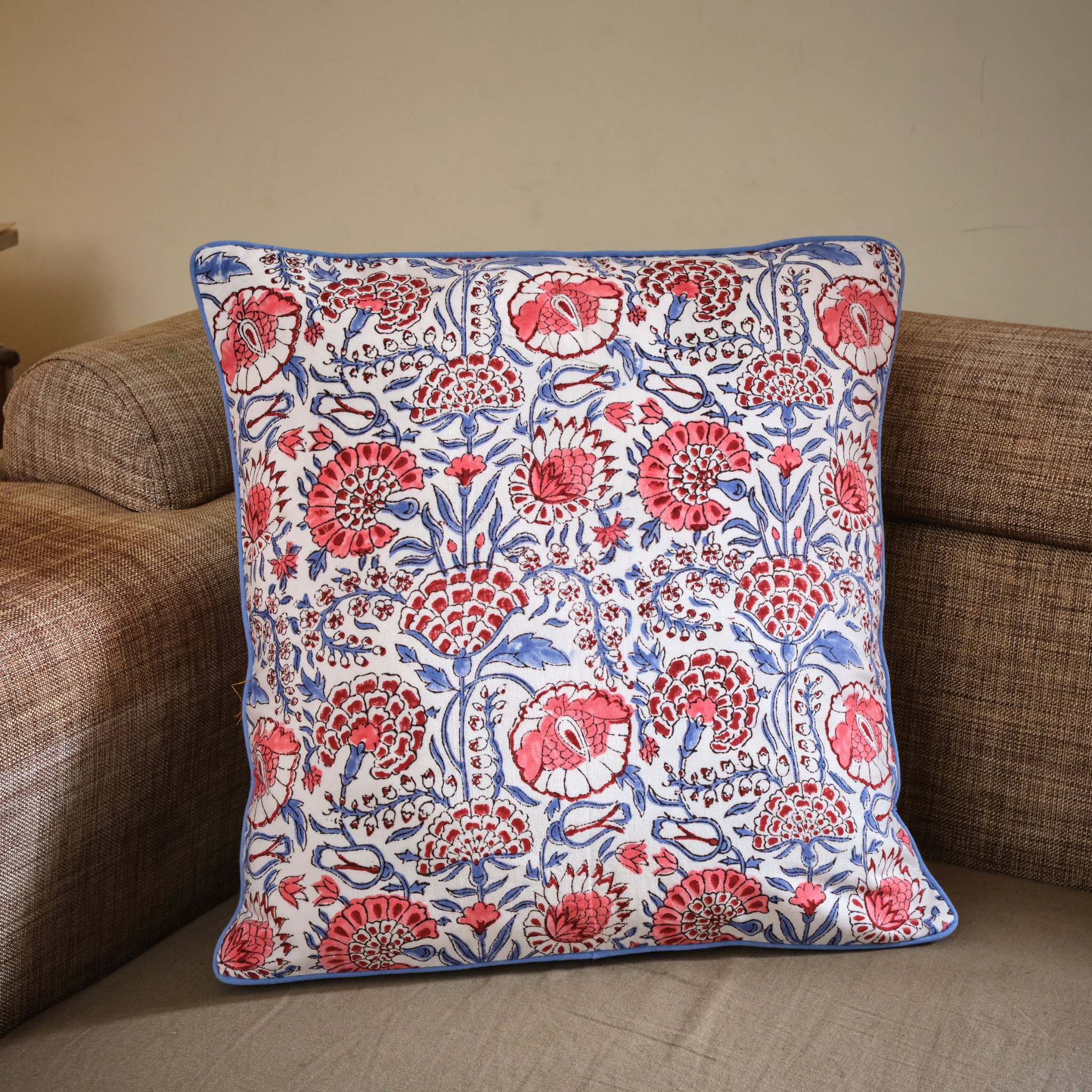 Decorative pillow with floral pattern on a couch