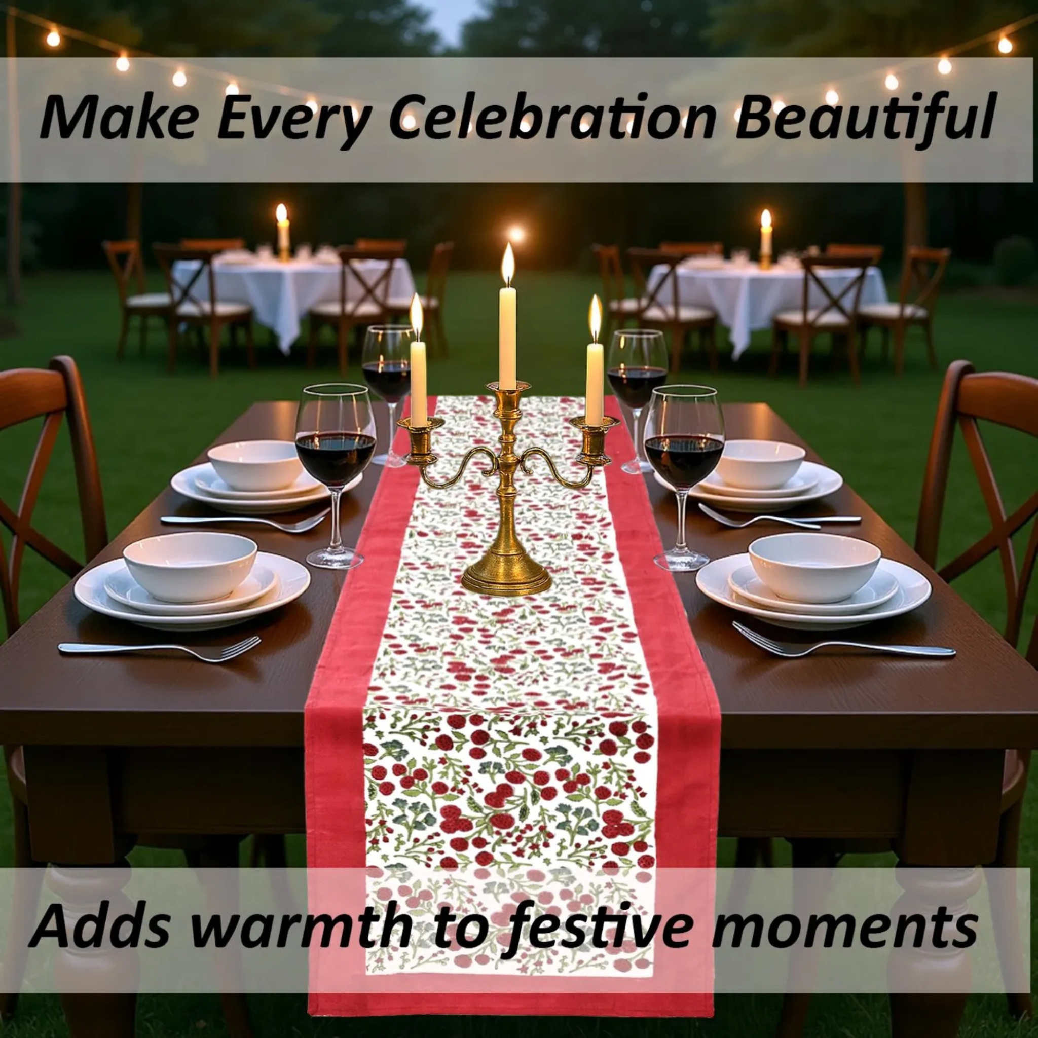 Dining table set with a floral table runner, candles, and wine glasses outdoors.