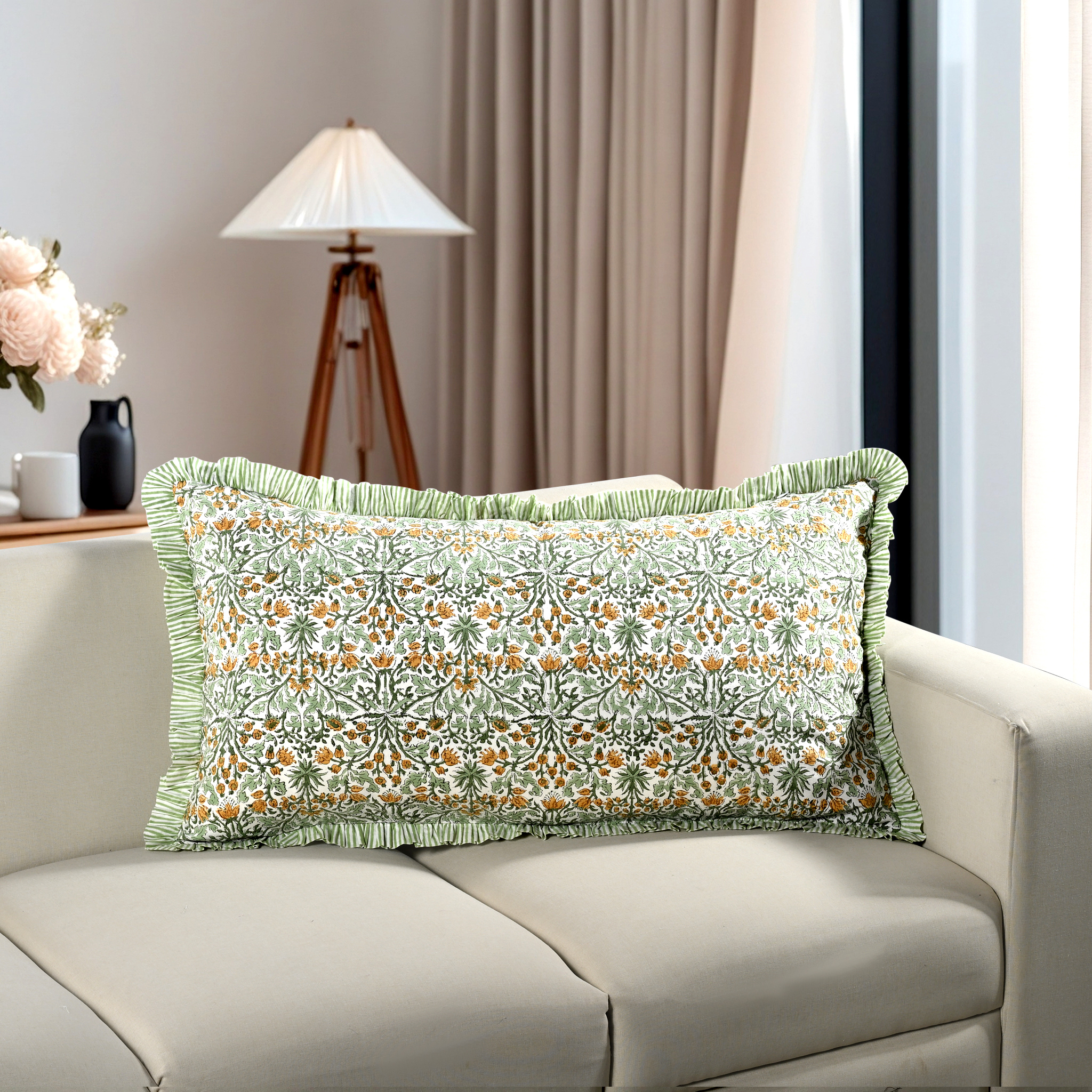 yellow floral block print cotton pillow styled on a beige sofa in living room.
