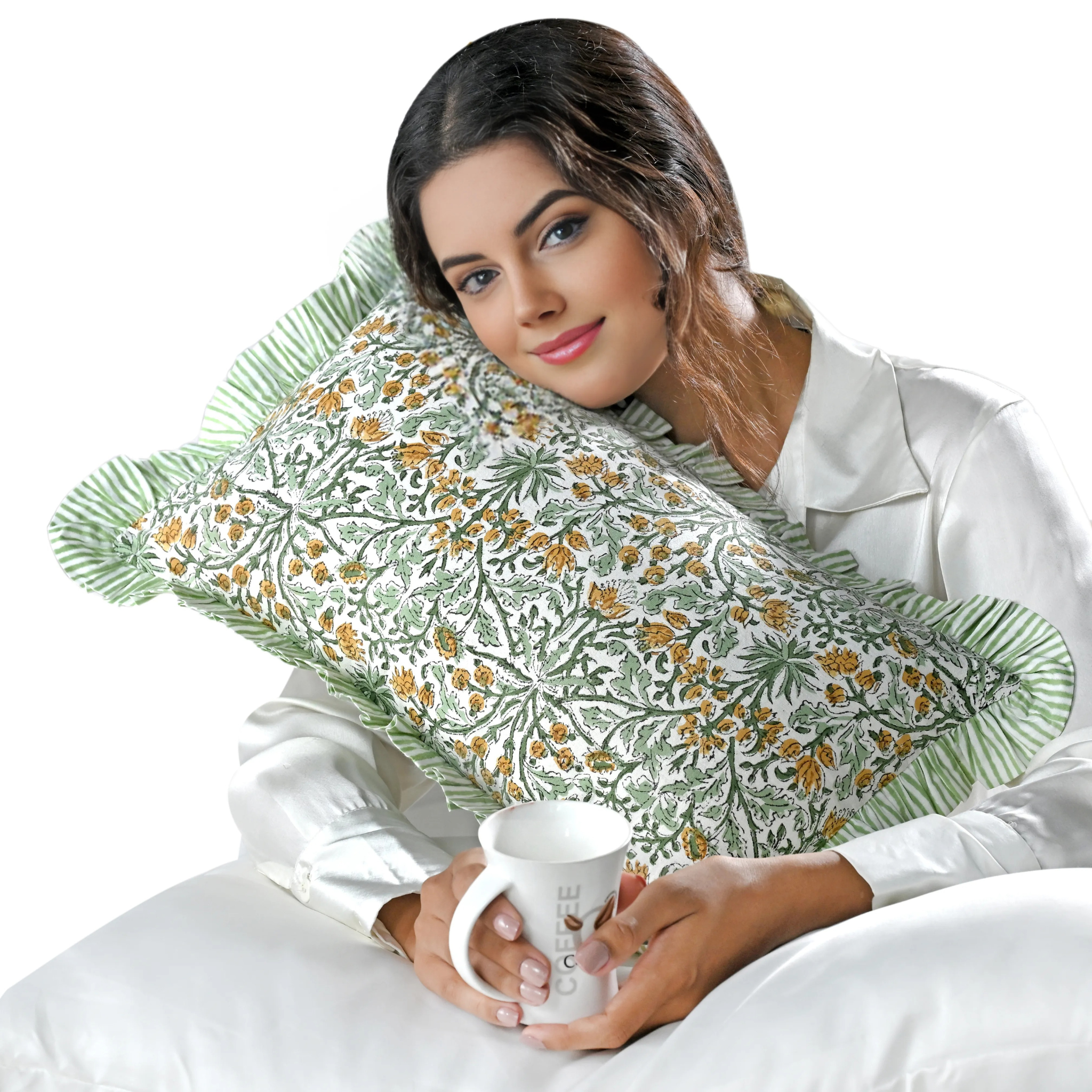 Woman holding a floral-patterned pillow and a mug with a white background