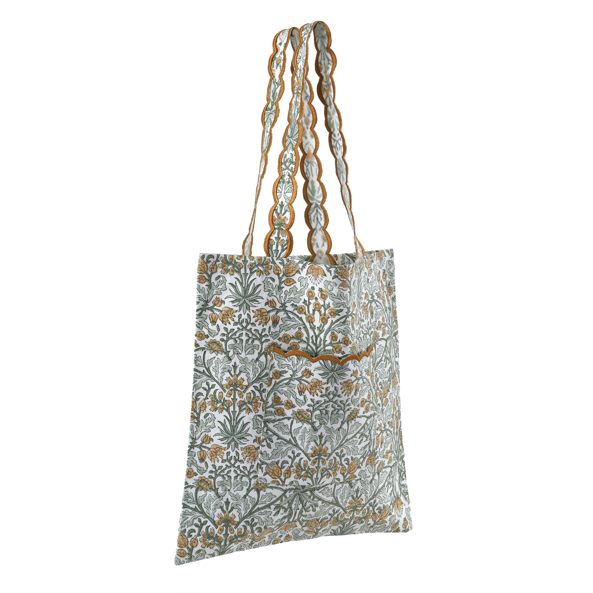 Floral patterned tote bag with braided handles on a white background