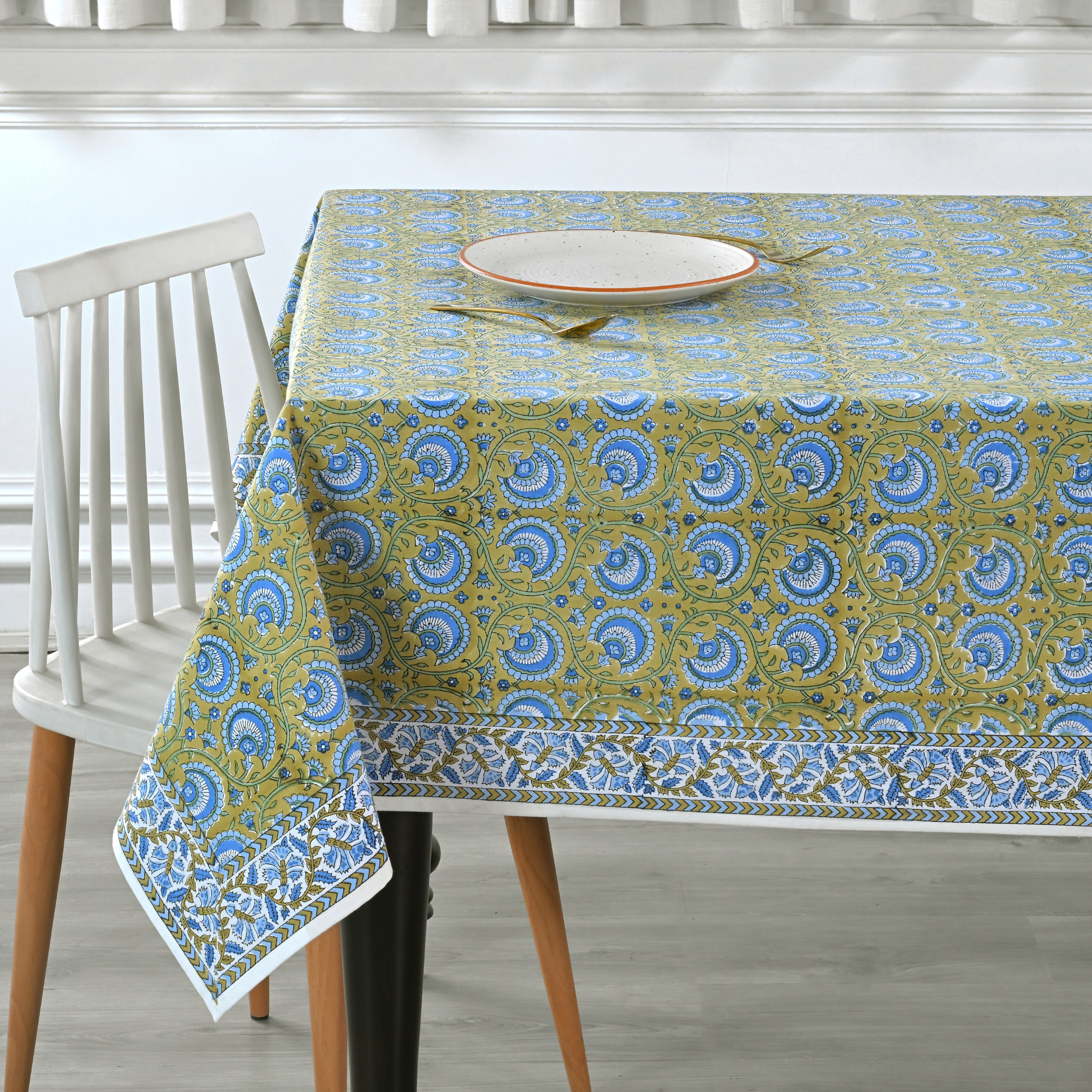Tablecloth with blue and green pattern on a dining table
