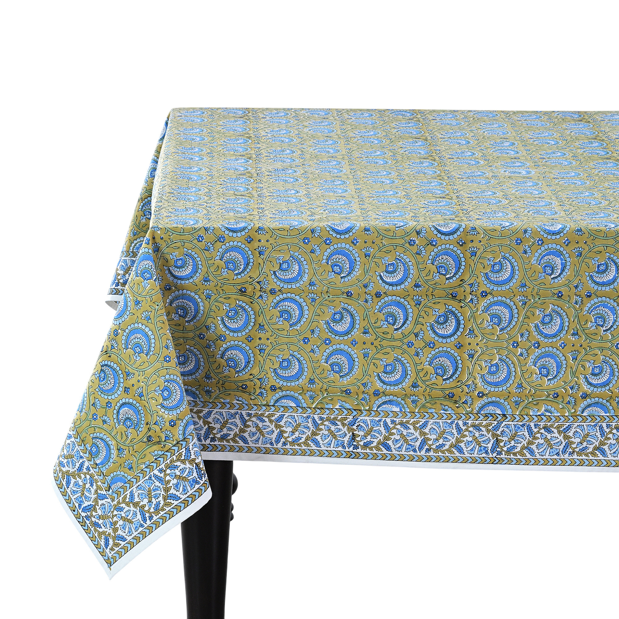 Patterned tablecloth on a table with a white background