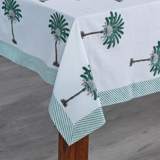 Tablecloth with palm tree design on a wooden table