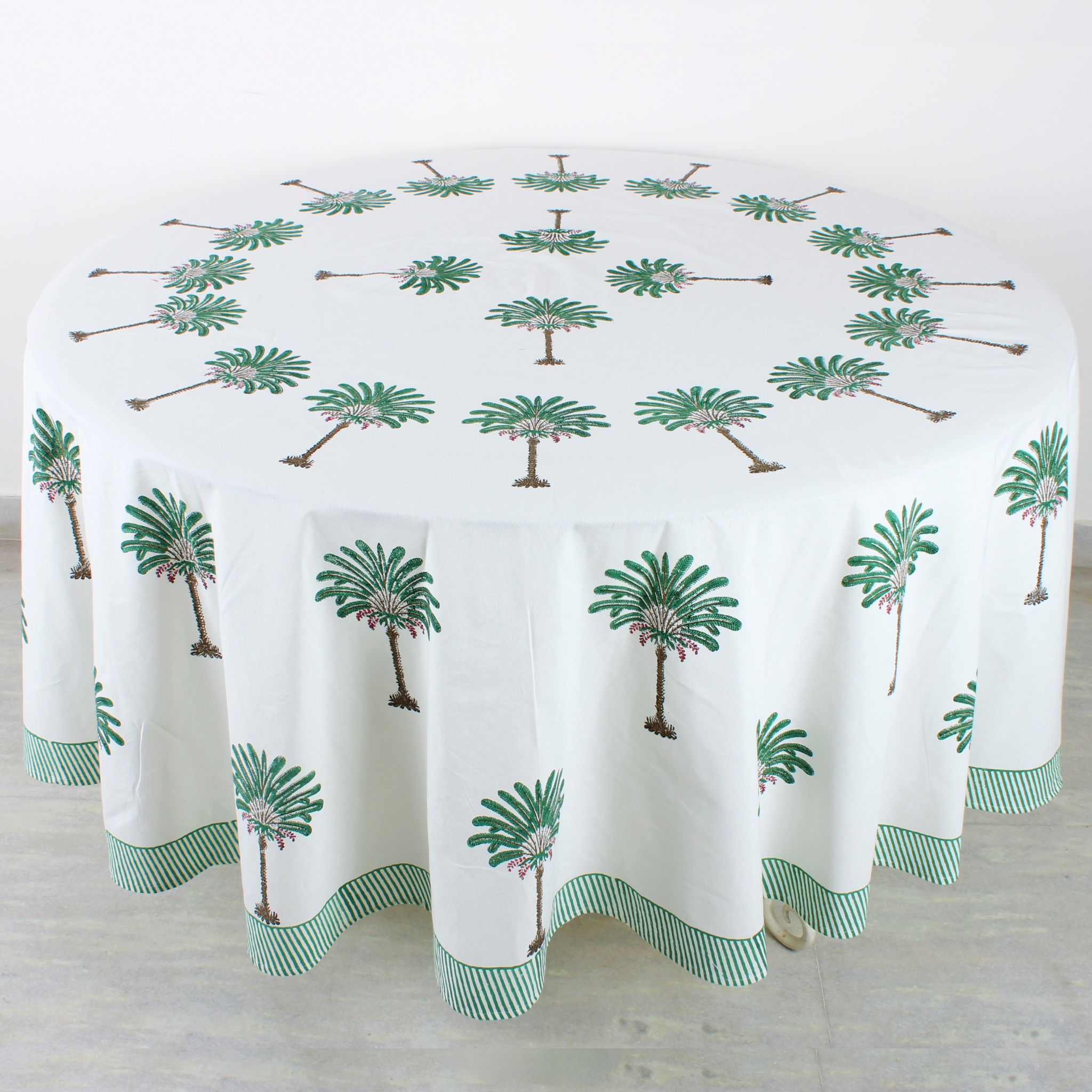 Round tablecloth with palm tree design on a white background