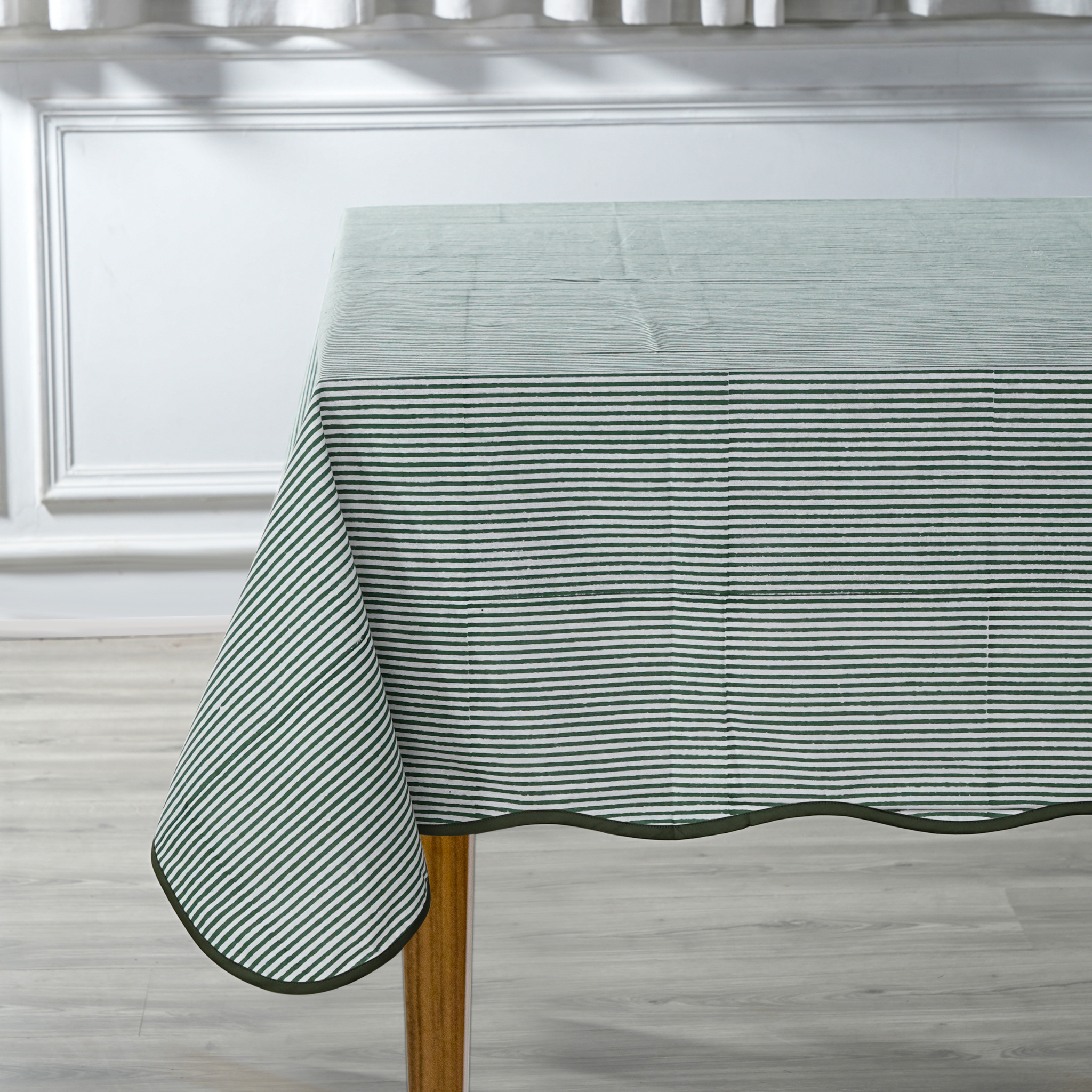 Striped tablecloth on a wooden table in a kitchen setting