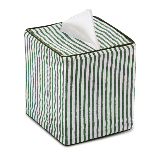Green and white striped tissue box with a tissue peeking out on a white background