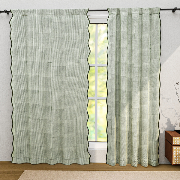 Green textured curtains with a window in the background