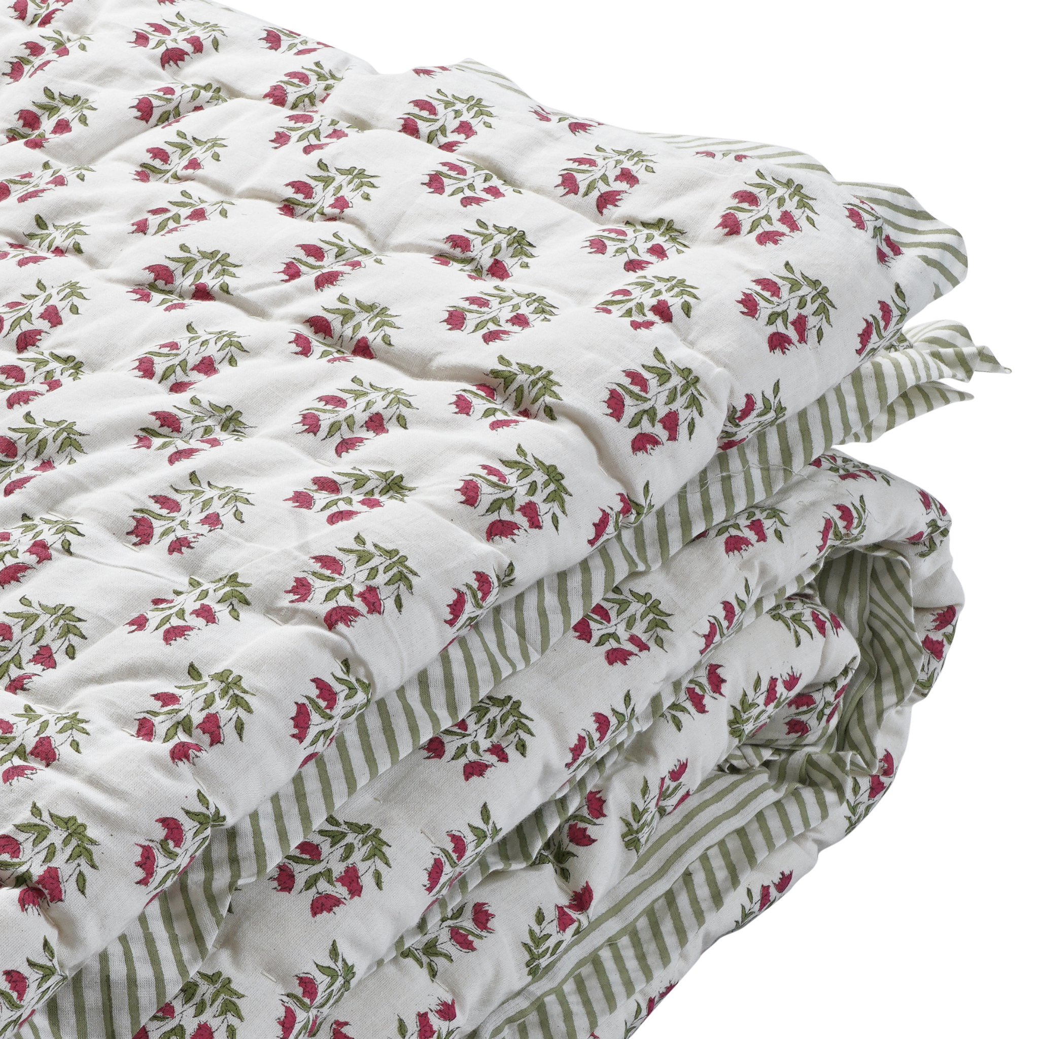 Floral and striped quilt on a white background