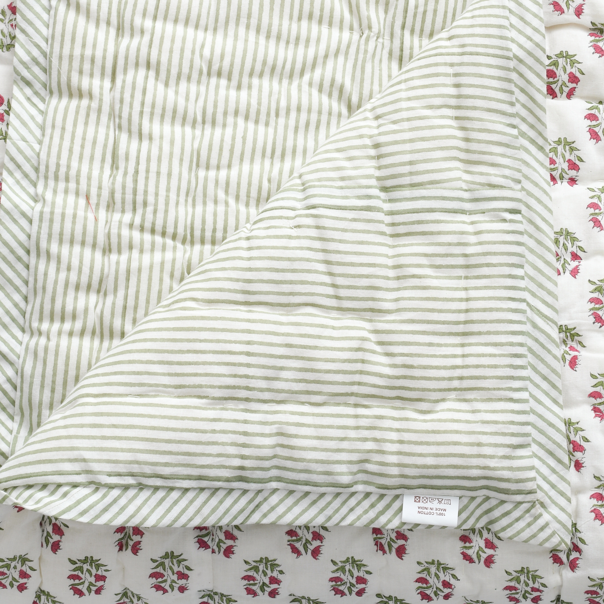 Striped fabric with a floral patterned border