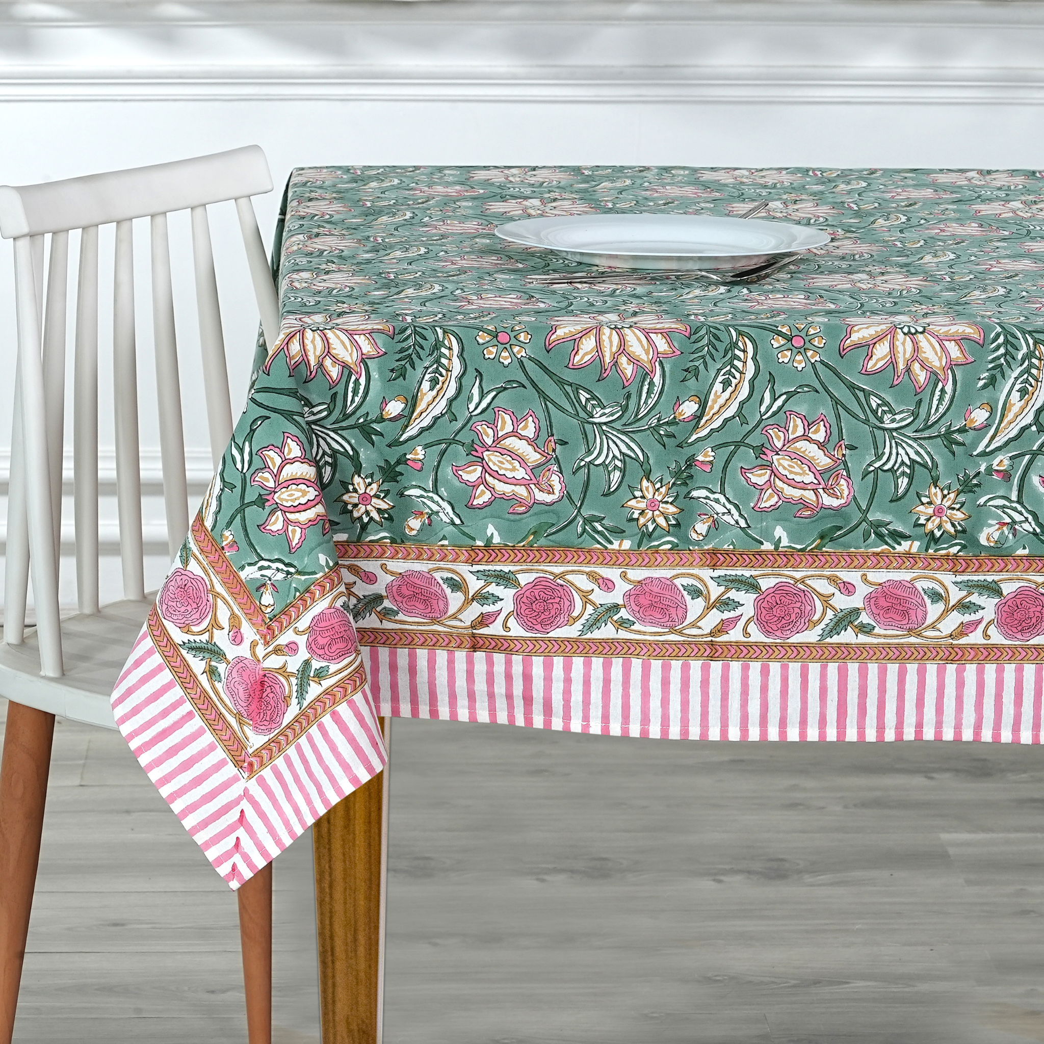 Tablecloth with floral pattern on a wooden table