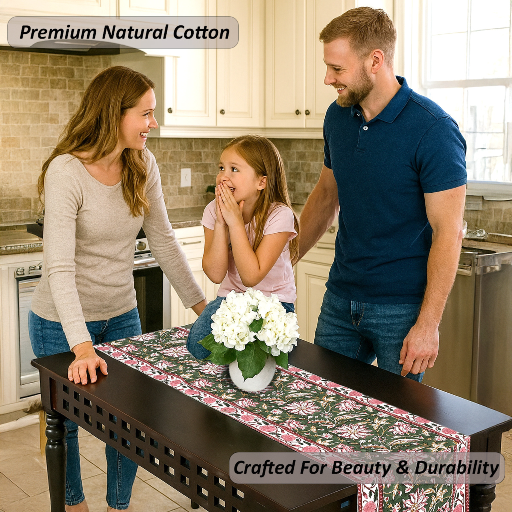 Family in a kitchen with a table runner featuring white flowers.