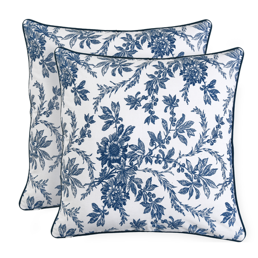 Two blue floral patterned pillows on a white background