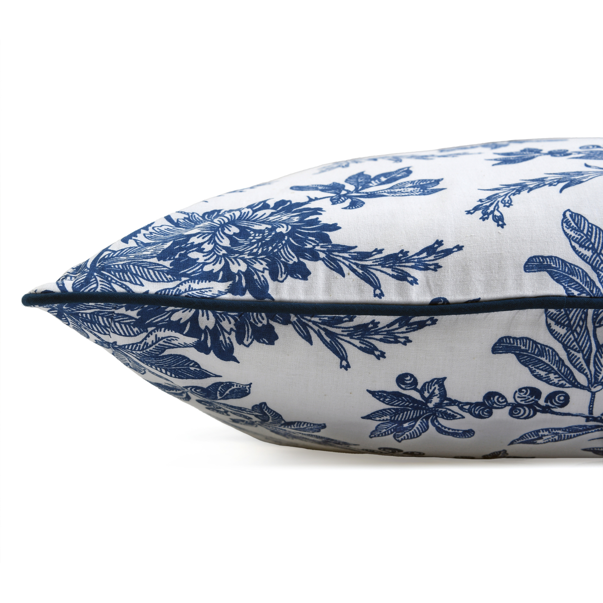 Decorative pillow with blue floral pattern on white background