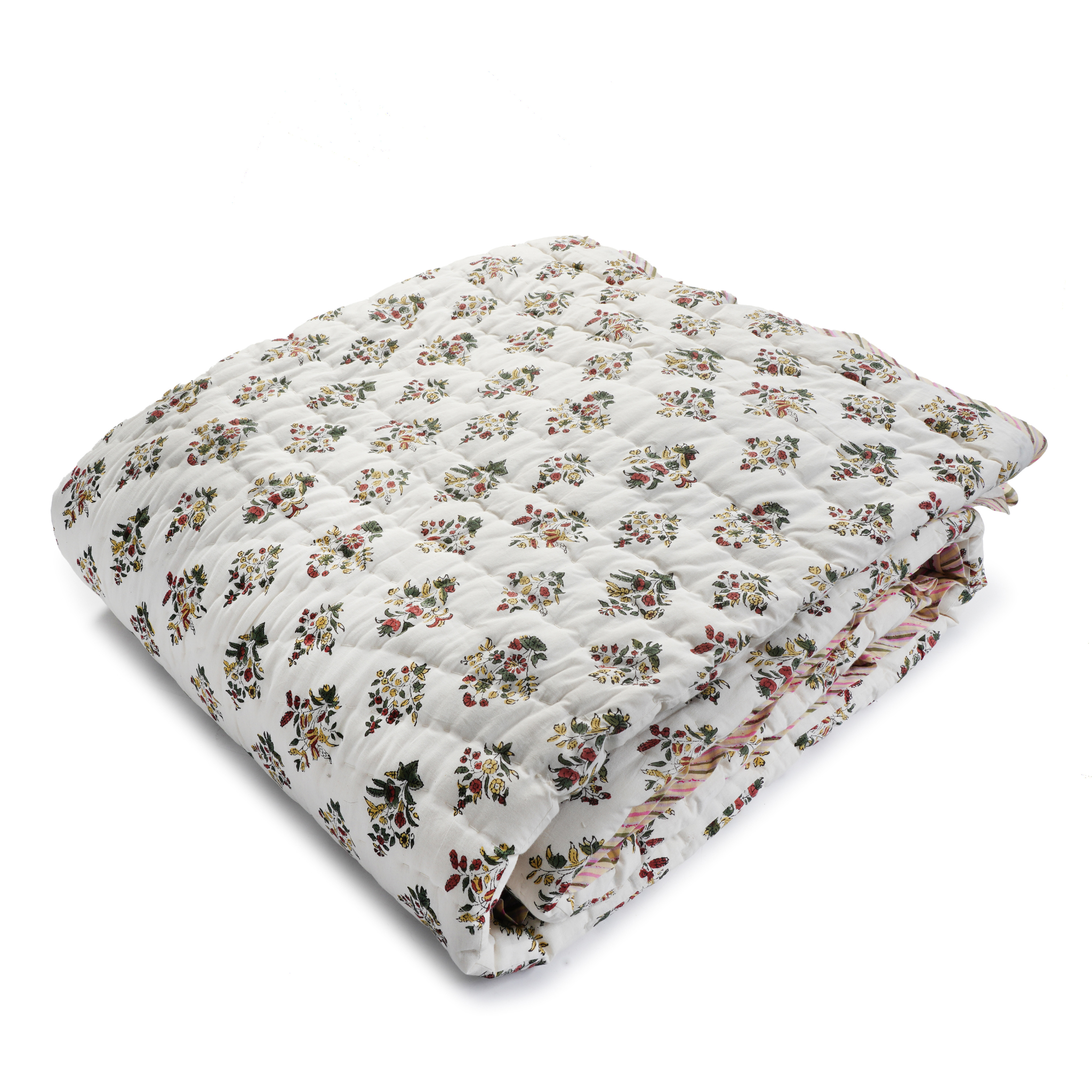 Floral patterned quilt on a white background