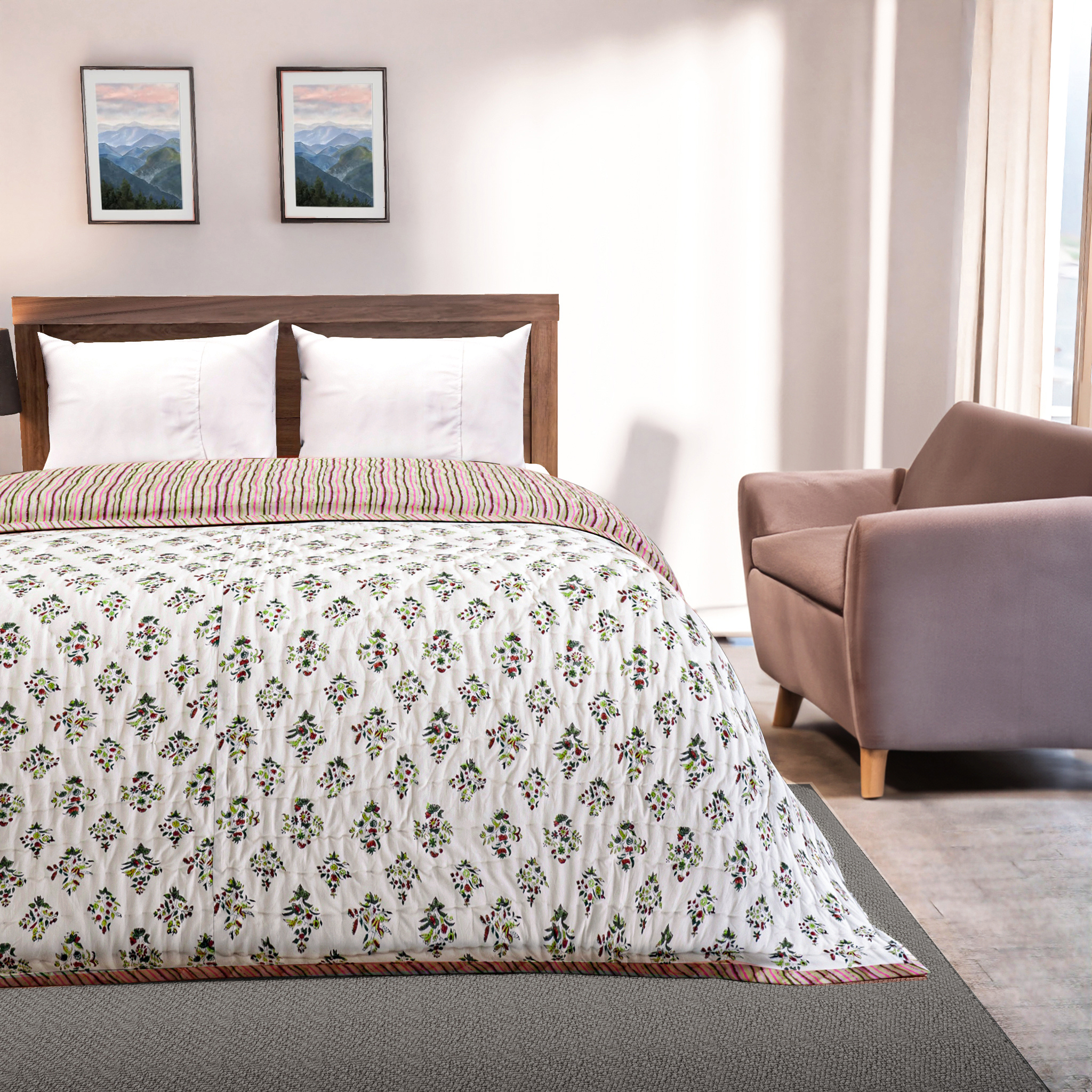 Bedroom with floral comforter, wooden headboard, and armchair.