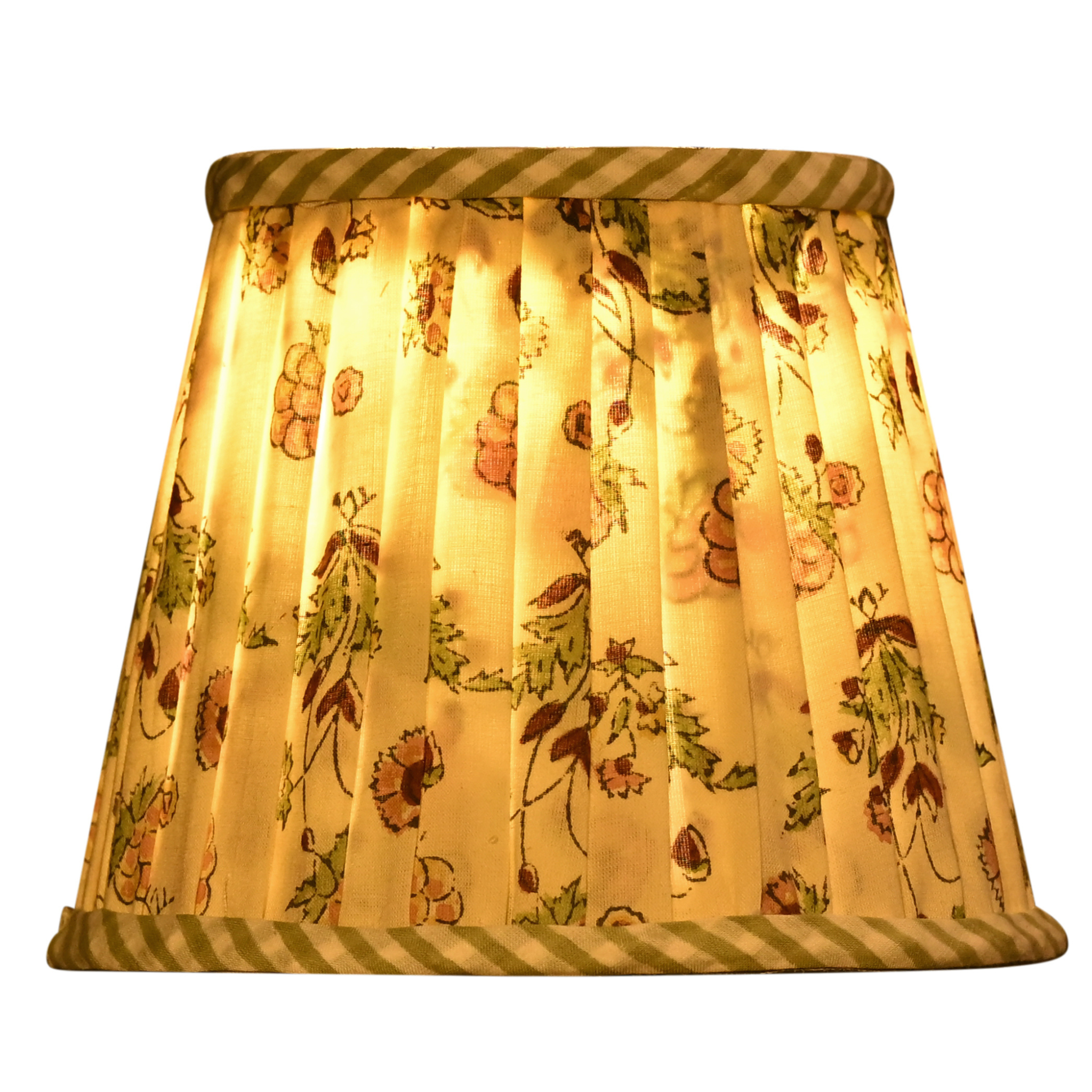 Floral patterned lampshade with striped trim on a white background